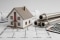Das bild zeigt einen Gebäudegrundriss, darauf ein Modellhaus, Heizungsrohre und einen Taschenrechner als Symbol für die Bedeutung der Heizlastberechnung bei der Heizungsplanung. 
