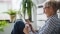 Das Bild zeigt eine Frau mit grauen Haaren und Tablet in den Händen als Sinnbild für die Steuerung der Viessmann ViCare Komponenten per App.